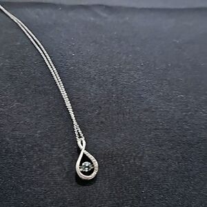 Sterling silver necklace and pendant with blue topaz stone.